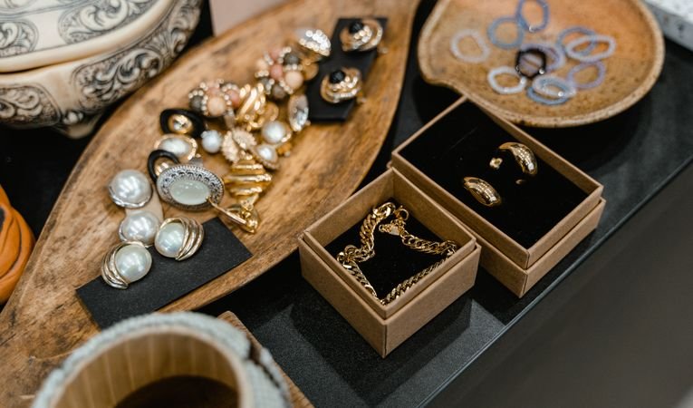 Jewellery displayed on wooden jewellery box tray